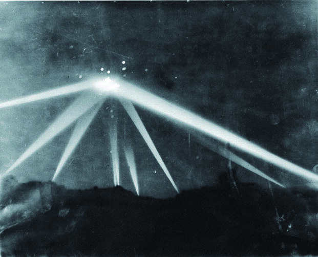 The 1942 Battle of Los Angeles, searchlights focused on an unidentified object while anti-aircraft fire is visible